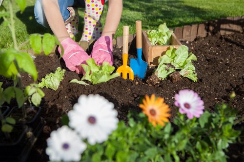 Community garden planting with volunteers and seasonal workers